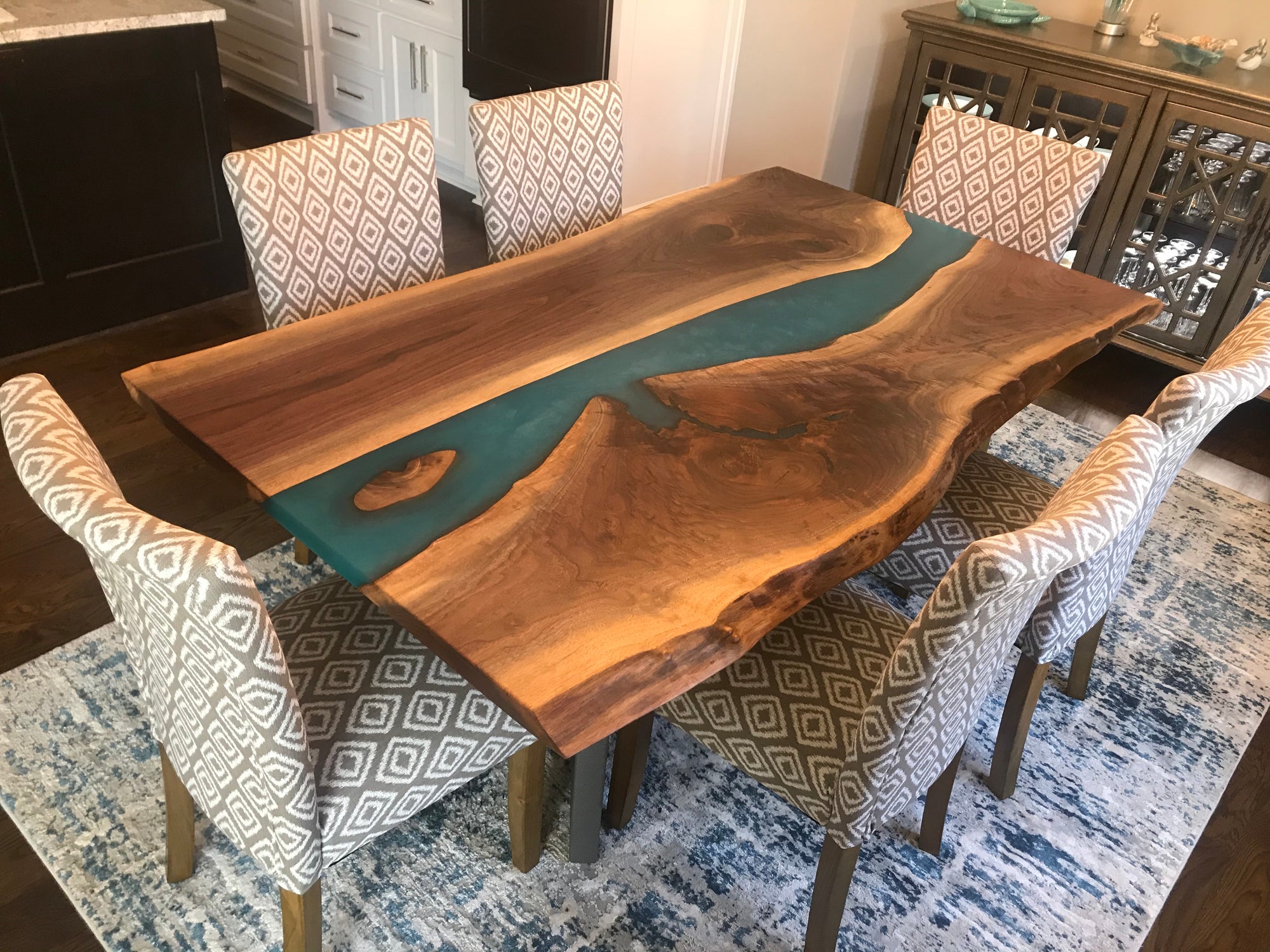 live edge black walnut epoxy river dining table with custom blue epoxy